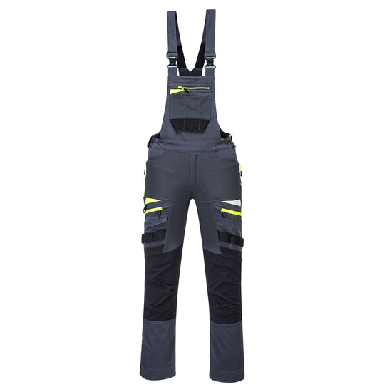 Metal Grey DX4 work bib and brace with large chest pocket and visible tool loops on the legs. Bib and brace have yellow trim on the zips and shoulder braces with black trim on the kneepad area.