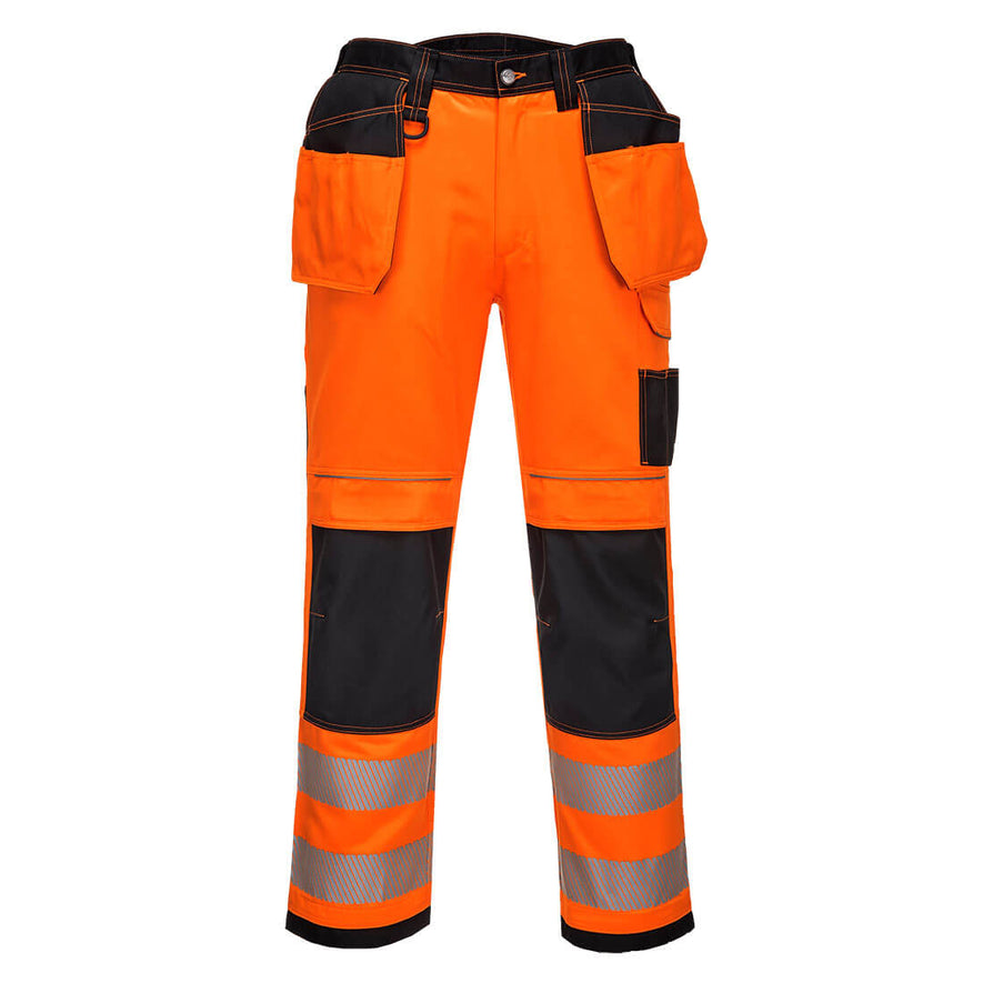 PW3 Hi-Vis Stretch Holster trousers in Orange with black contrast on the belt and pocket area as well as the kneepad pocket area. Trousers have pockets, belt loops, knee pad pockets and holster style pockets. Trousers have hi vis bands on the ankles.