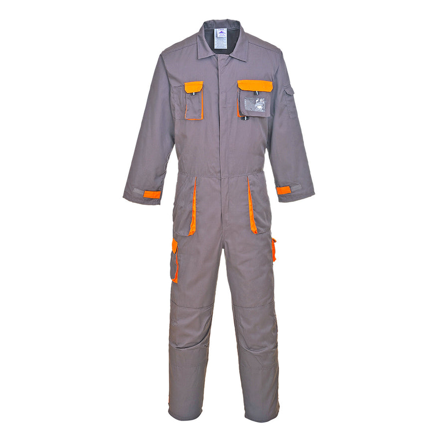 Grey portwest Texo coverall, Coverall has pockets on the sides, legs and chest. Chest pocket on the left has a ID badge holder. Coverall has orange contrast on the pocket outer.