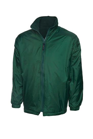 Uneek Clothing UC606 Childrens Reversible Fleece Jacket with waterproof outside in bottle green with full zip fastening and two lower pockets.