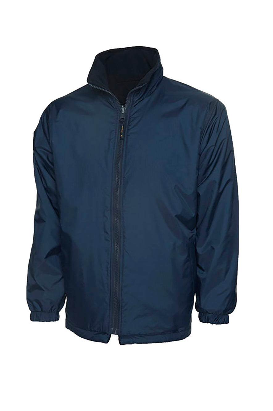 Uneek Clothing UC606 Childrens Reversible Fleece Jacket with waterproof outside in navy with full zip fastening and two lower pockets.