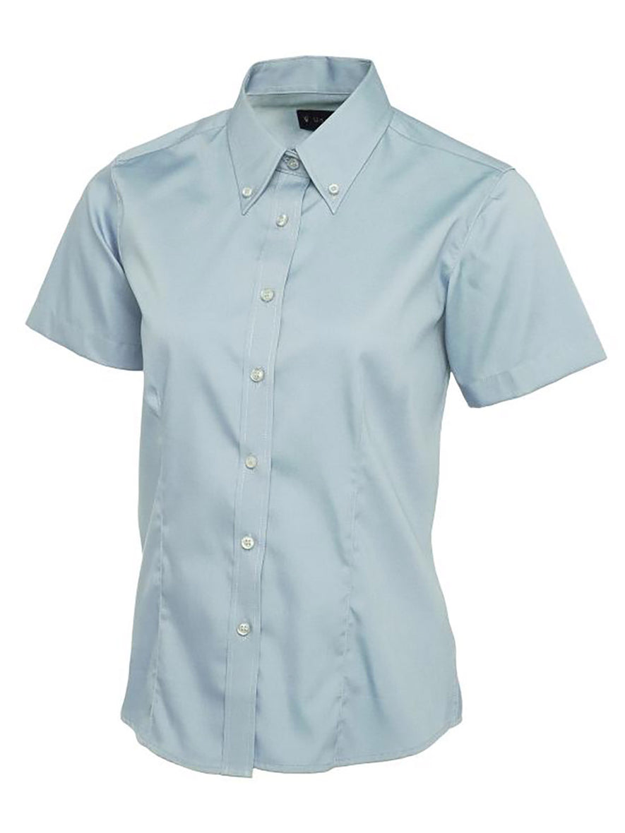 Uneek Clothing UC704 Ladies Pinpoint Oxford Half Sleeve Shirt in light blue with light blue buttons and collar with light blue buttons.