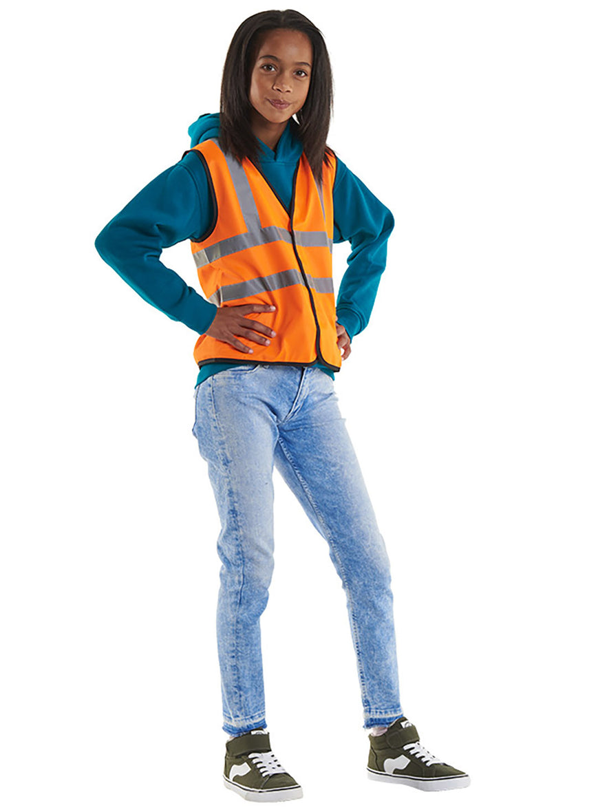 Person wearing Uneek Clothing UC806 Childrens Hi-Viz Waist Coat in orange with black piping around edges with two strips of reflective tape across chest and one over each shoulder.