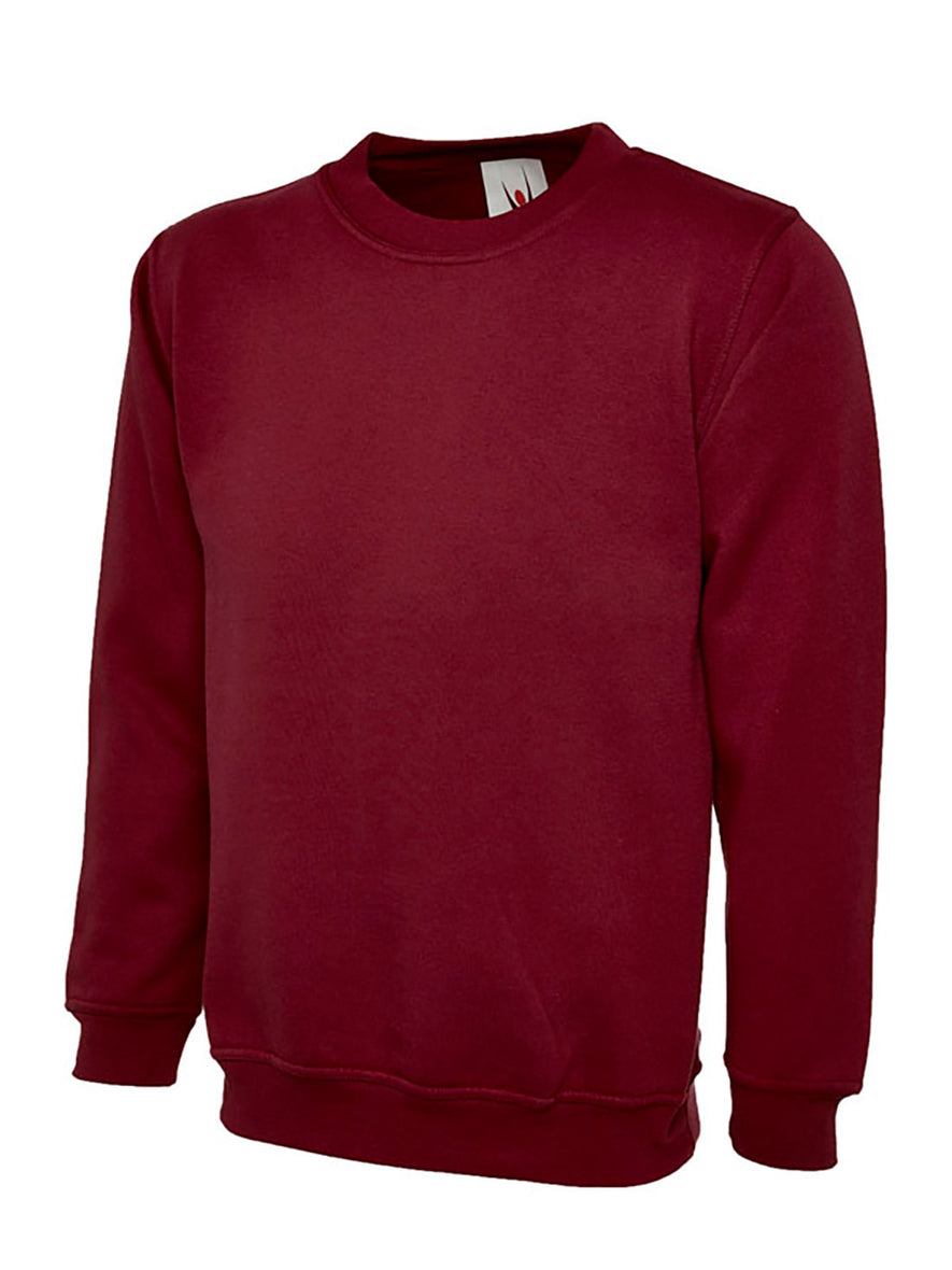 Uneek Clothing UX7 The UX Children's Sweatshirt in maroon with long sleeves, crew neck and elasticated wrists and bottom.